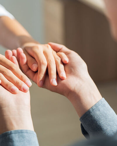 young-man-holding-hands-girlfriend